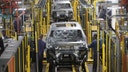 Workers assemble Ford vehicles at the Chicago Assembly Plant