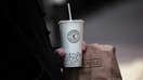 A customer holds a bag of food and a beverage cup outside a Chipotle restaurant in New York, US, on Friday, Jan. 12, 2024. - Fox Business News