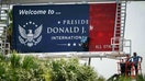 Workers install the new road entrance signage at Palm Beach International Airport in unincorporated Palm Beach County, Fla., on July 8, 2026. - Fox Business News