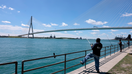 People fish in the Detroit River in front of the Gordie Howe International Bridge in Detroit, Michigan, on June 12, 2026.  - Fox Business News