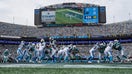 A general view as Bryce Young #9 of the Carolina Panthers hands the ball off to teammate Rico Dowdle #5 during the third quarter against the Miami Dolphins in the game at Bank of America Stadium on Oct. 5, 2025 in Charlotte, North Carolina. - Fox Business News