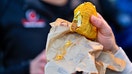 A customer holds a Taco Bell taco on Saturday, November 29, 2025, in Alexandria, Virginia. - Fox Business News