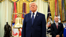President Donald Trump stands next to a bell before ringing it to open the New York Stock Exchange ahead of the launch of Trump investment accounts in the Oval Office. - Fox Business News