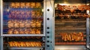 Rotisserie chickens cook inside a commercial roasting oven. Consumer Reports evaluated chickens from warehouse clubs, grocery stores and big-box retailers based on taste, nutrition and other factors. - Fox Business News