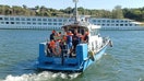 A Bulgarian border police boat evacuates passengers from a stranded cruise ship on the Danube River after the Swiss-flagged Viking Ullur ran aground near the northwestern city of Vidin, Bulgaria, in this handout image released on Tuesday, July 28, 2026.  - Fox Business News