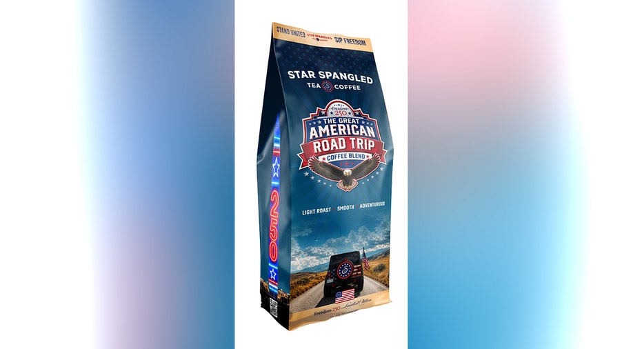 A blue bag of Star Spangled Tea & Coffee’s Great American Road Trip light-roast coffee blend featuring patriotic graphics, a bald eagle and a vehicle traveling on an open road.
