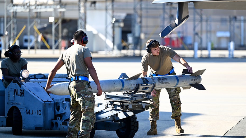 An AMRAAM missile being loaded