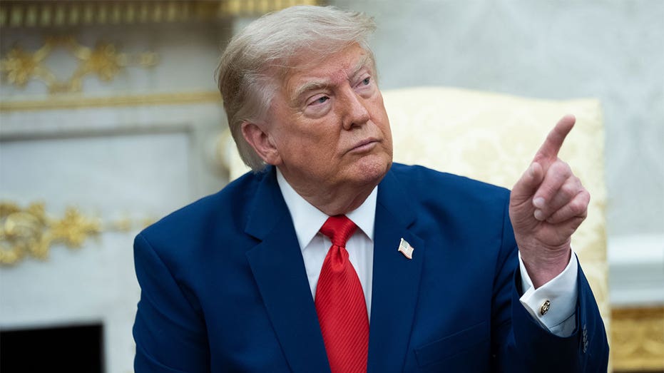 President Donald Trump points while speaking during a meeting in the Oval Office at the White House.