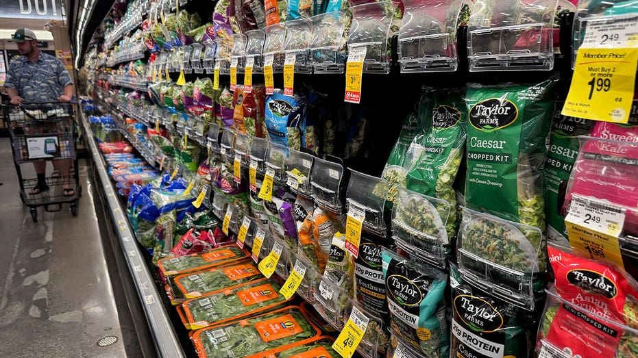 Packages of Taylor Farms salad greens displayed on shelves at a Safeway grocery store in California
