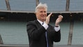 Mark Walter of the Guggenheim Baseball Management group, applauds a speech by partner Earvin "Magic" Johnson at a press conference introducing them as new Dodgers owners in center field at Dodger Stadium. - Fox News