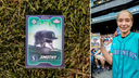 Jimothy Mariners rookie card and 13-year-old fan Abby holding the rare one-of-one gold card at T-Mobile Park