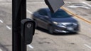 An aerial view of a Flock Safety camera mounted to a light pole on August 03, 2026 in Burbank, California. Flock Safety's automated license plate reader cameras have been deployed in over 120,000 locations across 49 states, using artificial intelligence to identify vehicles by their license plates, make, model and color to help law enforcement investigate crimes, while also drawing criticism from privacy advocates over concerns about mass surveillance and the collection of motorists' location data.