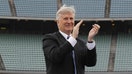 Mark Walter of the Guggenheim Baseball Management group, applauds a speech by partner Earvin "Magic" Johnson at a press conference introducing them as new Dodgers owners in center field at Dodger Stadium. - Fox Business News