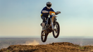 Motocross rider driving a motorcycle off-road - Fox Business News