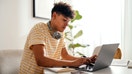 A teenager studies near a computer at his home. - Fox Business News