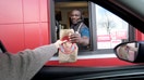 Store manager Kwame Poku serves food through the drive-thru window at a new Wendy&rsquo;s restaurant in Powell, Ohio, a suburb of Columbus. The restaurant chain is headquartered in another Columbus suburb, Dublin. - Fox Business News