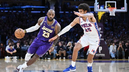 LeBron James of the Los Angeles Lakers dribbles the ball against Dominick Barlow of the Philadelphia 76ers during the second half of the game between the two teams at Crypto.com Arena on February 05, 2026 in Los Angeles, California. - Fox Business News