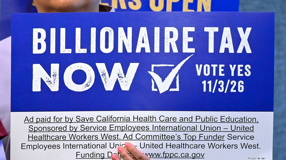 "BILLIONAIRE TAX NOW" signage