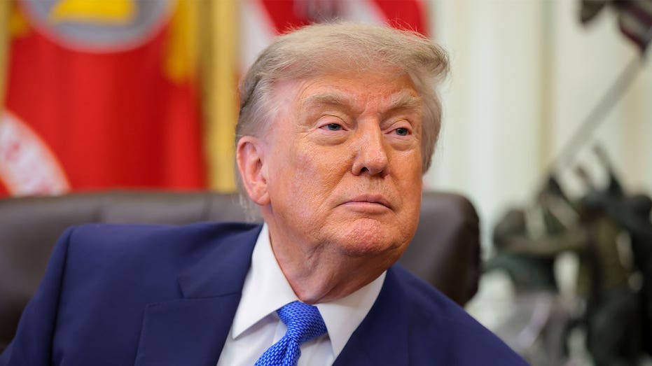 President Donald Trump takes questions from reporters in the Oval Office at the White House