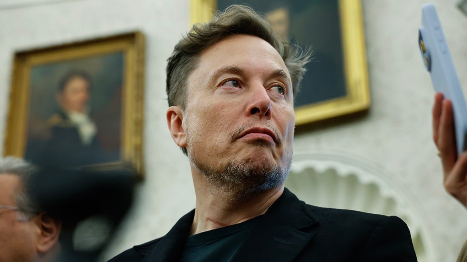 Elon Musk looking away