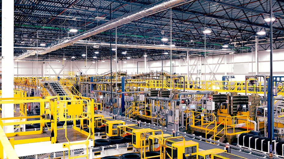A wide view of Ford’s Louisville Assembly Plant shows rows of yellow industrial equipment and production machinery.