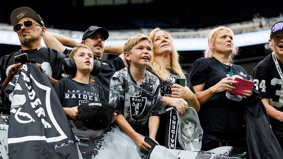 Raiders fans looks on field