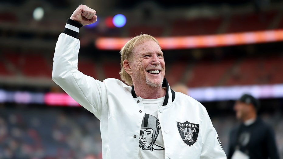 Raiders owner Mark Davis reacts on field