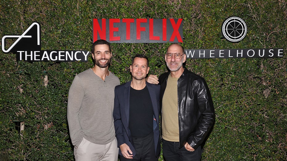 Billy Rose, right, attends the