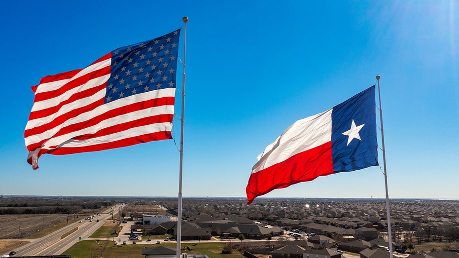 US and Texas flags fly over starter homes
