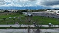 Aerial view showing the long debris path and perimeter damage from the runway overrun. - Fox News