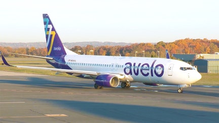 An Avelo Airlines aircraft parked on an airport tarmac. - Fox Business News