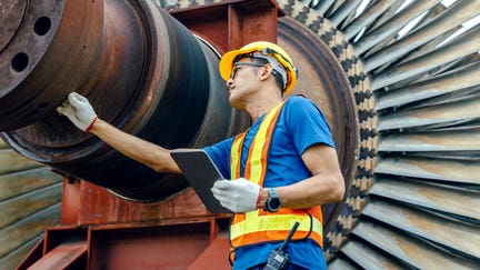 A worker at a power plant checks a turbine. - Fox Business News