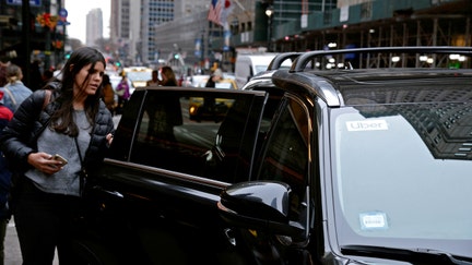 A passenger enters an Uber car in New York City, New York, U.S., December 6, 2019.  - Fox Business News