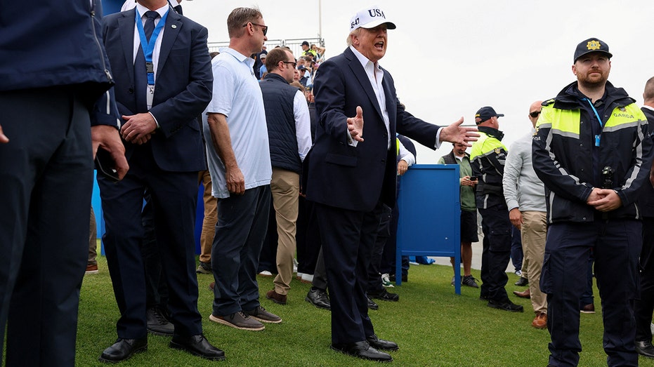 Donald Trump gestures with his hands while speaking