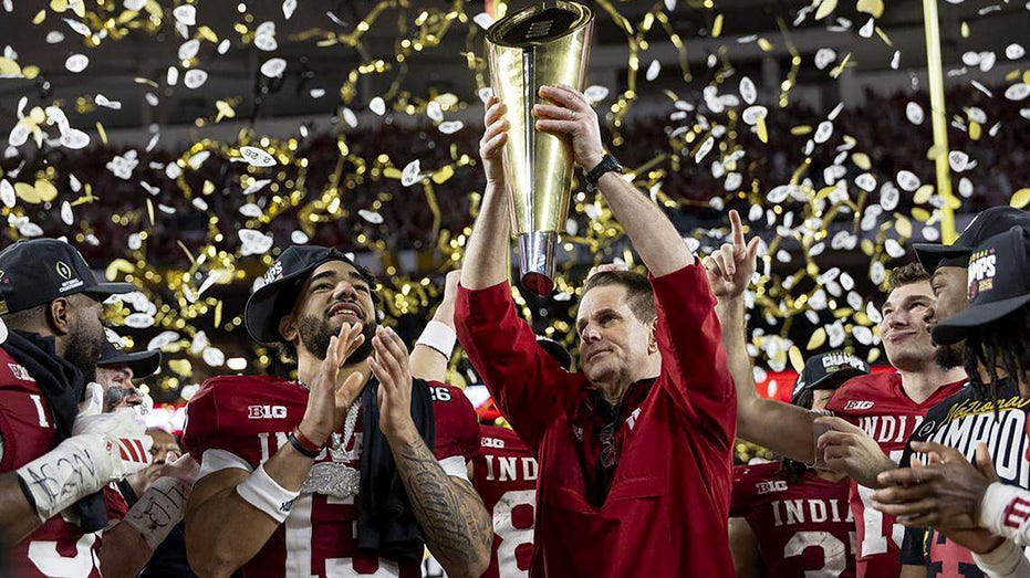 Indiana head coach Curt Cignetti celebrates a national title