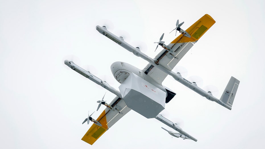 A Wing drone operated through DoorDash flies from a Lowe’s store
