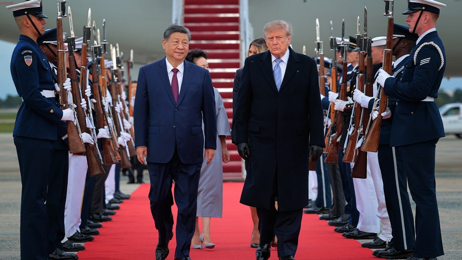 trump and xi walking together from plane