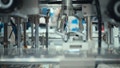 Close-up of a robotic arm or automated system precisely manipulating tiny components - Fox News