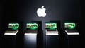 Four Apple MacBook Pro laptops sit on display beneath the company's logo during a product presentation. - Fox News