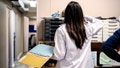 A doctor handles paperwork in an office. - Fox News