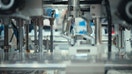 Close-up of a robotic arm or automated system precisely manipulating tiny components - Fox Business News