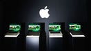 Four Apple MacBook Pro laptops sit on display beneath the company's logo during a product presentation. - Fox Business News
