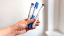 A person holds multiple GLP-1 injection pens. - Fox Business News