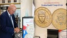U.S. Treasurer Brandon Beach appears alongside a dollar coin exchange machine and a display featuring both sides of President Donald Trump's new $1 coin in a Treasury Department TikTok video. - Fox Business News