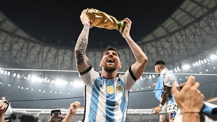 Lionel Messi of Argentina celebrates with the FIFA World Cup Qatar 2022 Winner's Trophy after the team's victory during the FIFA World Cup Qatar 2022 Final match between Argentina and France at Lusail Stadium on Dec. 18, 2022 in Lusail City, Qatar. - Fox Business News