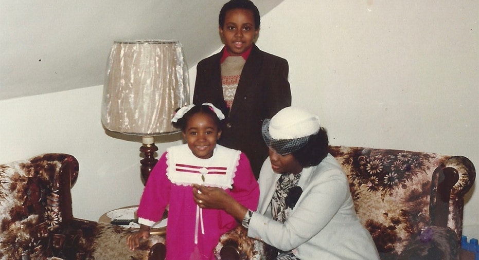 Patrice Onwuka childhood photo with brother, mother