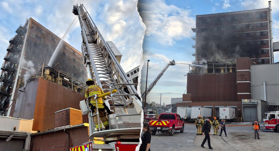 Firefighters work to extinguish a fire at the plant