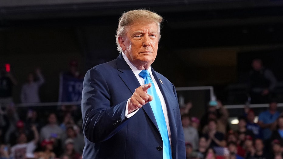 President Donald Trump gestures at midterms rally
