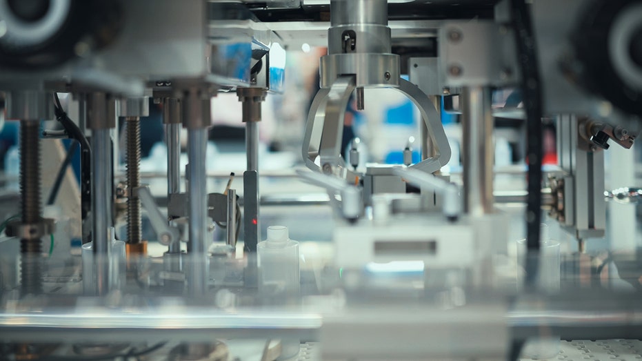 Close-up of a robotic arm or automated system precisely manipulating tiny components,