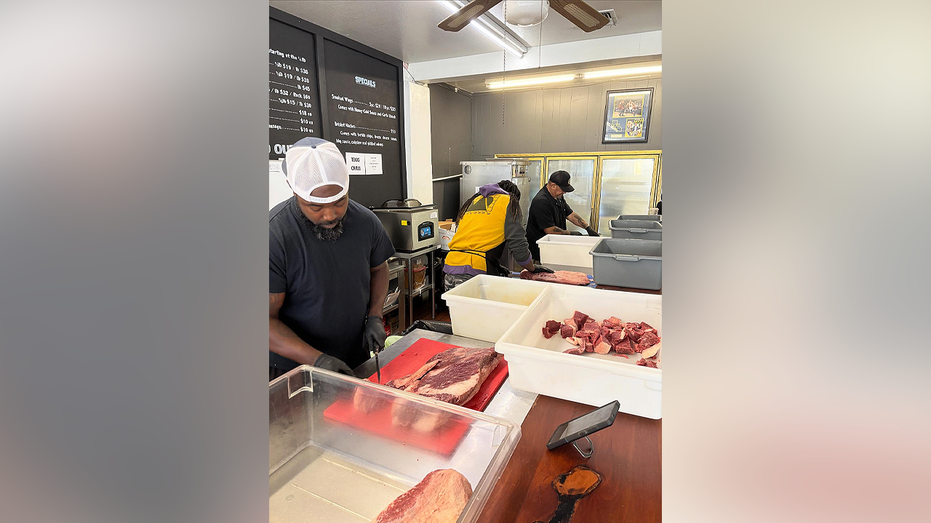 A&M BBQ staff prepare cuts of meat inside the Sebastopol, California, restaurant
